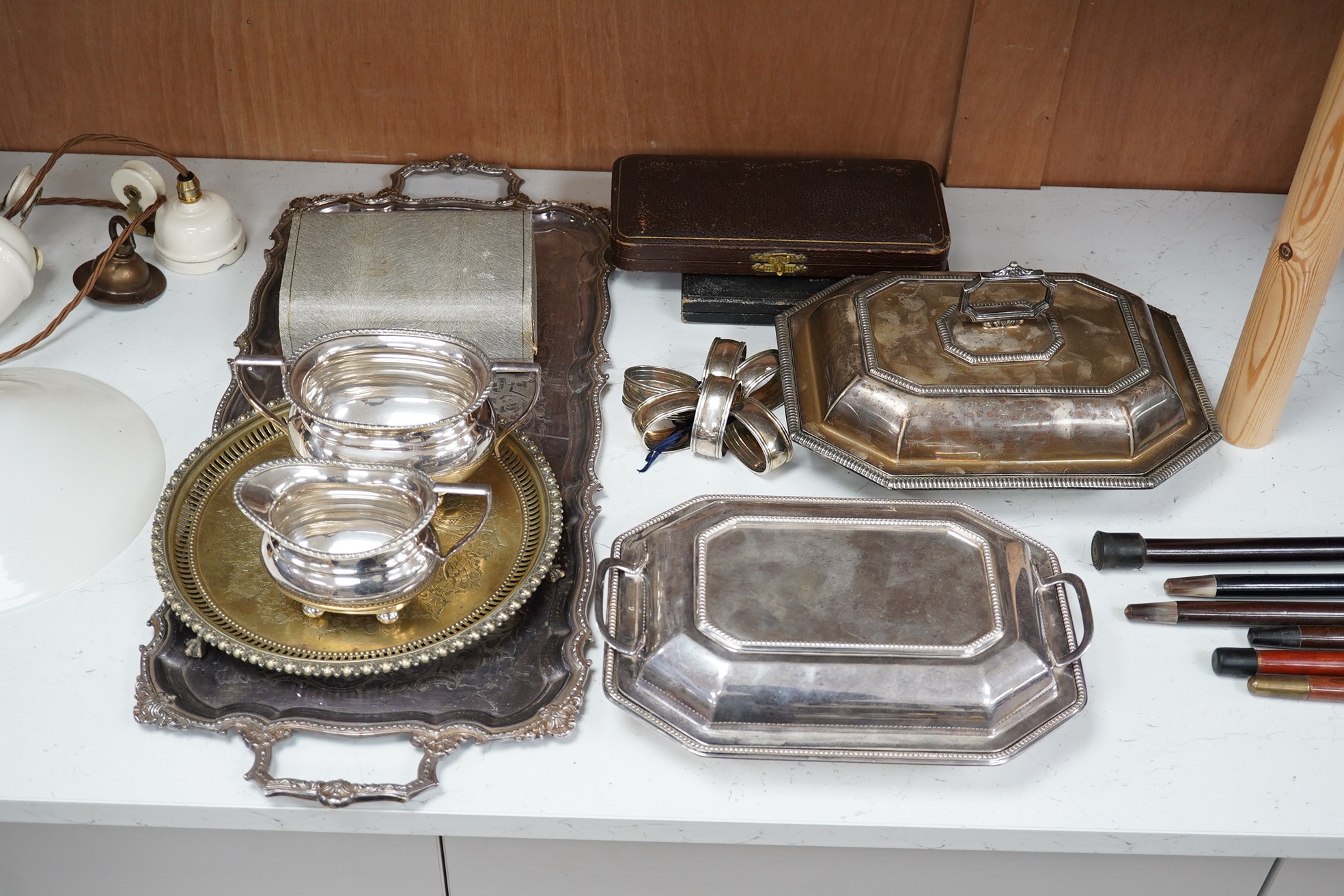 A quantity of plated wares including two entree dishes and covers, napkin rings, cream jug, trays, etc. Condition - fair